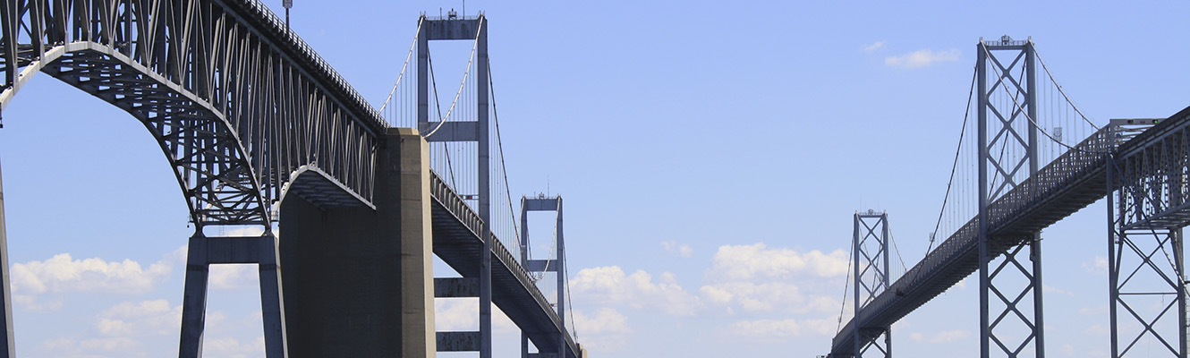 A view of both of the Chesapeake Bay Bridge spans from the water below the bridge