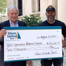 : President and CEO of Severn Savings Bank delivers $10,000 check to Founder of Operation Frederick Douglass on the Hill
(Left) Scott Beatty, Jr. – President & CEO of Severn Savings Bank
(Right) Tarence Bailey, Sr. – Founder of Operation Frederick Douglass on the Hill