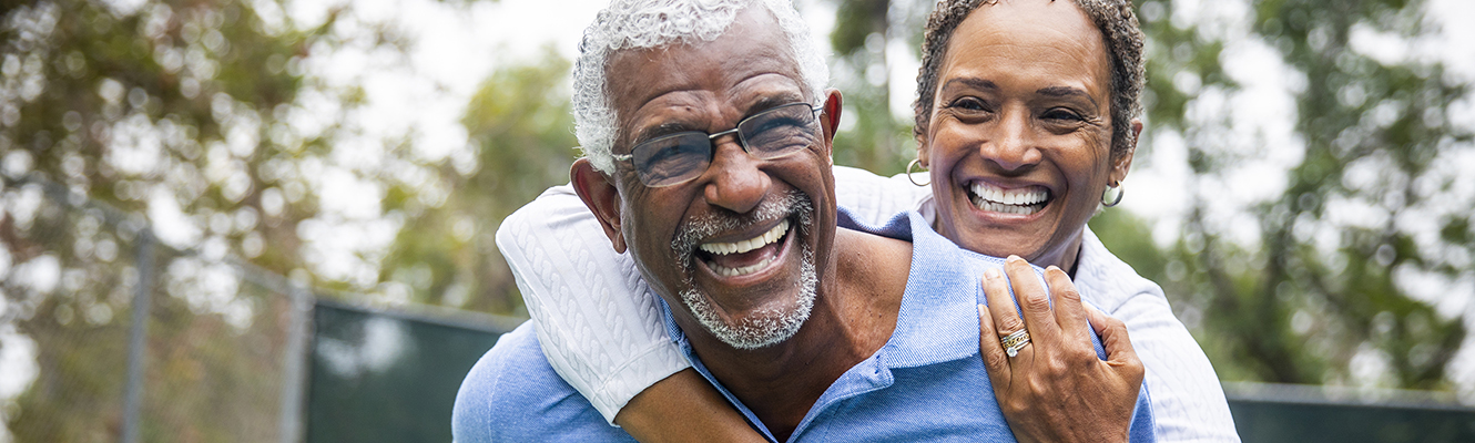 older couple hugging and laughing