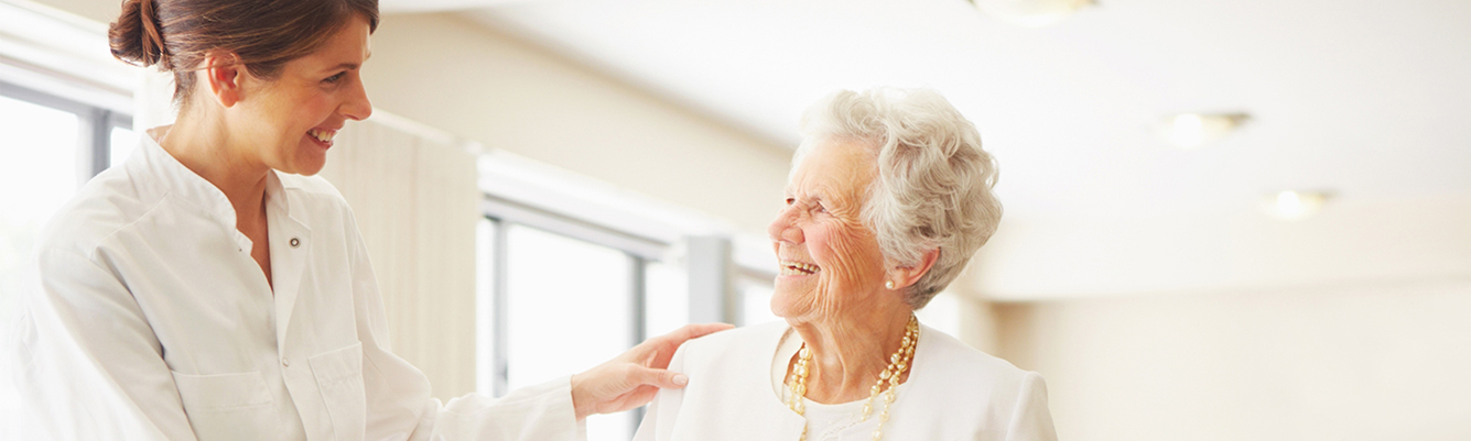 younger woman taking care of older woman