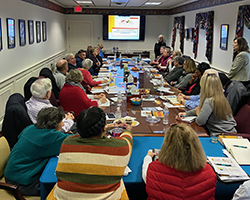 our dover st branch board room with people in it