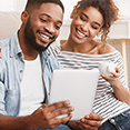 couple looking at tablet