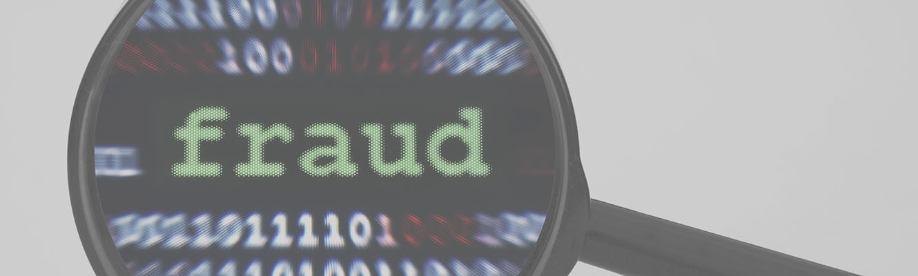 A magnifying glass over the word fraud