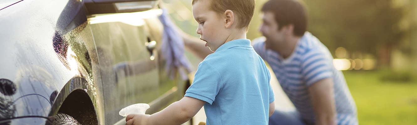 father and son washing car